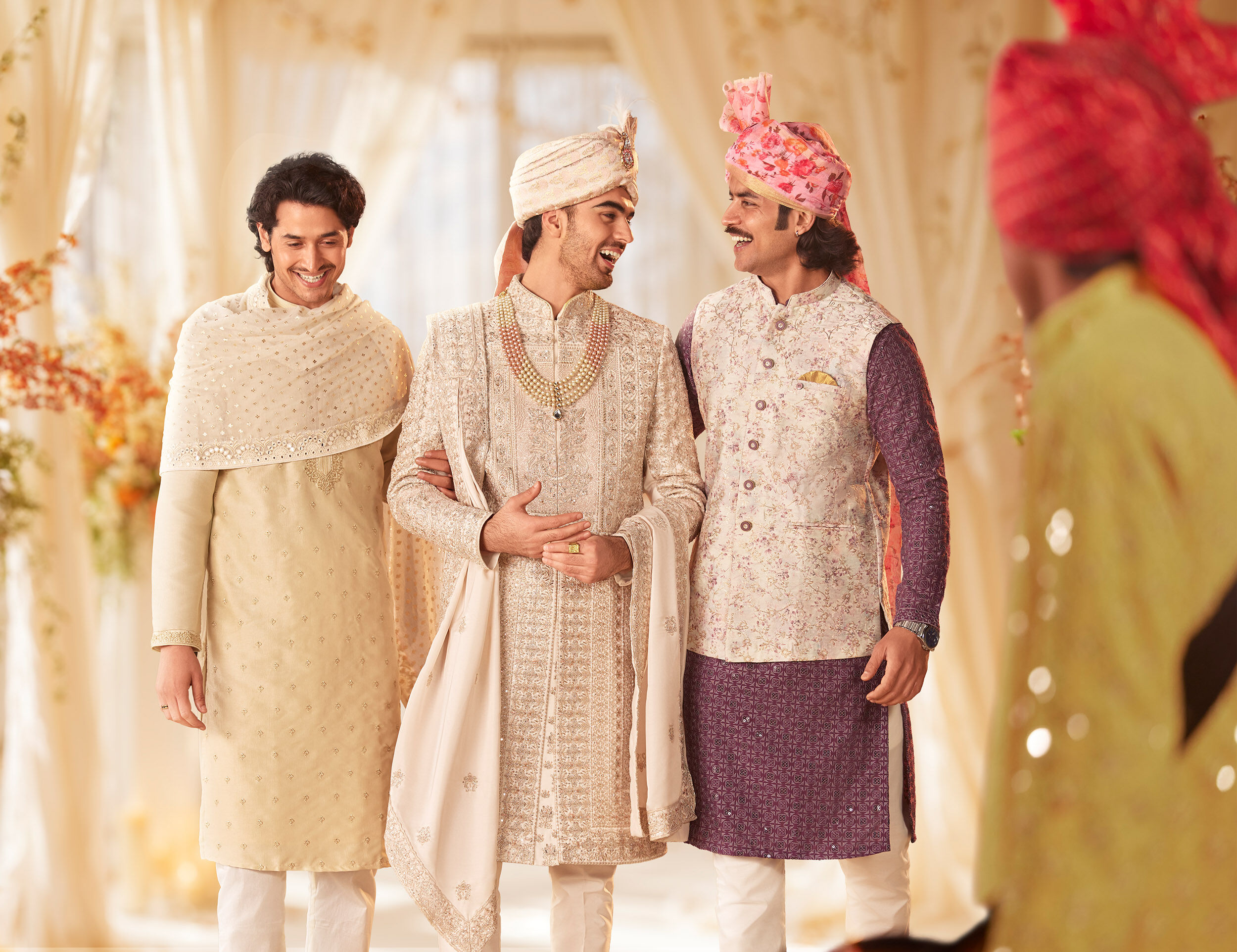 Groom and grooms men enjoying wedding celebration wearing traditional indian sherwanis